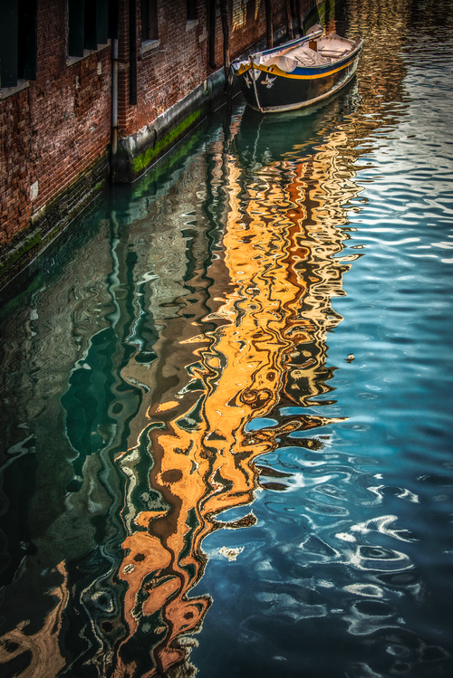Photo of reflections in Venetian canal